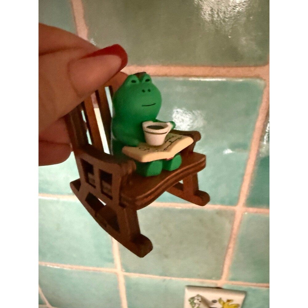 Mini frog in rocking chair